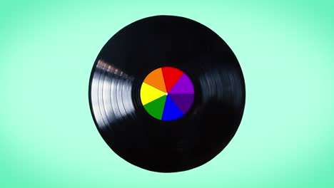 rainbow black vinyl loop record isolated on white background.  the rainbow colors are used by the lgbt community. the disk is also called newton disk