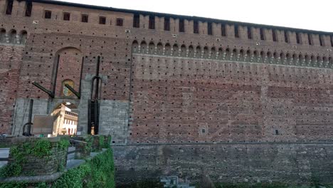 visitors walking near historic sforzesco castle