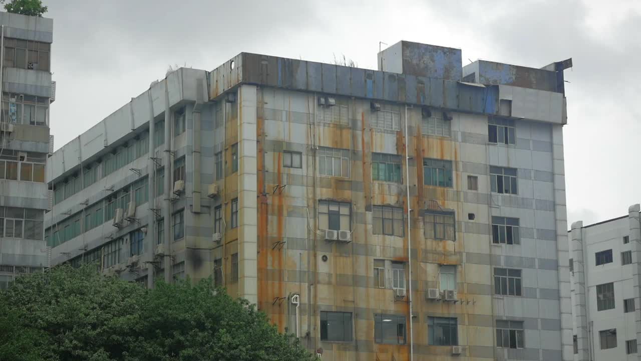 Old abandoned and rusty apartment building.
