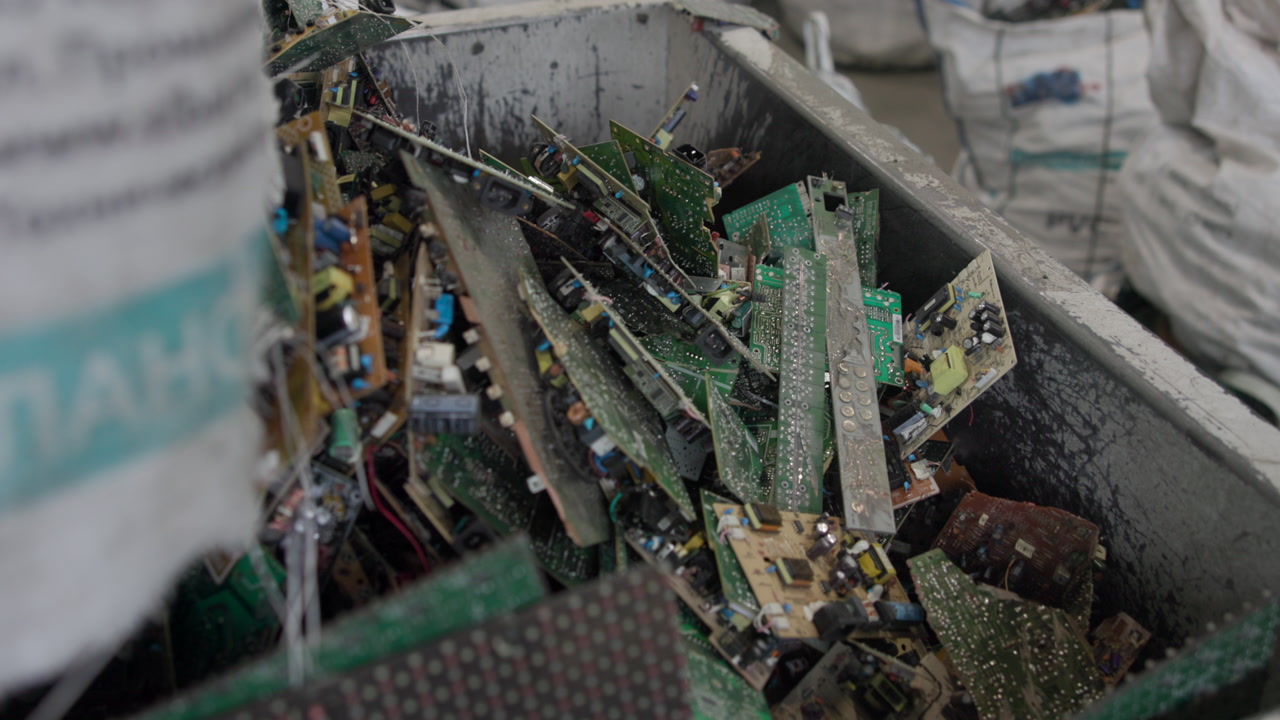 Piles Circuit Boards In Industrial Hopper, Dusty Green Pcbs Stacked With Wires And Components, Closeup . Media