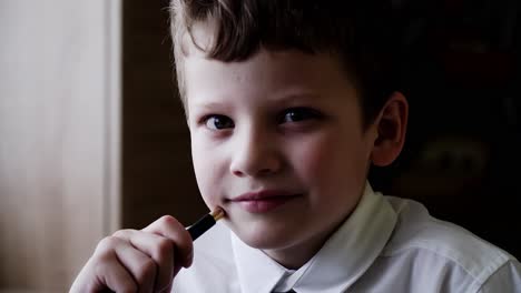 cu portrait of a boy who is preparing to go to school he smiles 2