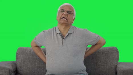 Sick-Indian-old-man-suffering-from-back-pain-Green-screen