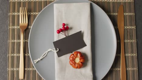 video of plate with autumn decoration lying on wooden mat