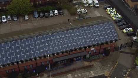 Widnes-town-police-station-with-solar-panel-renewable-energy-rooftop-in-Cheshire-townscape-aerial-Birdseye-rising-view