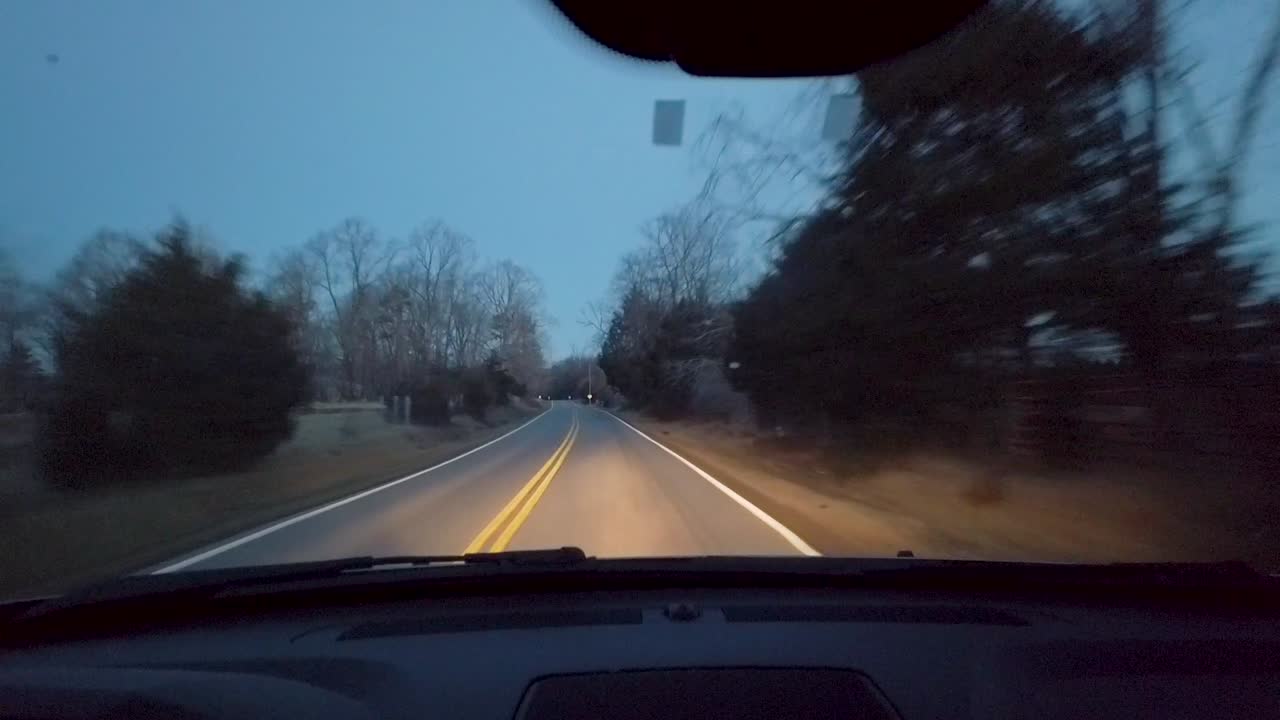Slow motion footage of driving along several roads in central Virginia