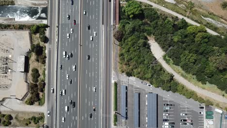 top down pan up view of highway traffic on 101 roof top solar panels pan handle garden zoom in