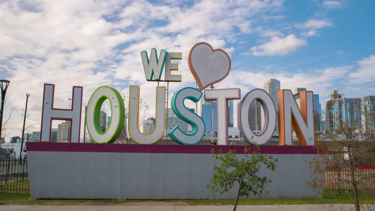 Time lapse of cloudy sky over the 'We Love Houston' Sign in Houston, Texas