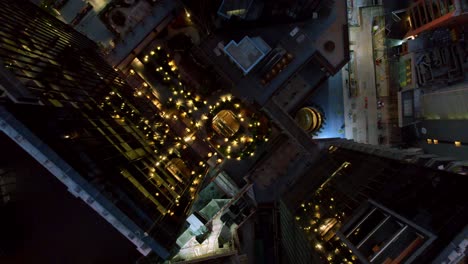 Topdown-view-of-Rooftop-Garden-decorated-with-bulb-lights-at-the-Mercado-Urbano-Tobalaba-at-night,-Chile