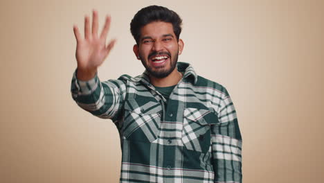 man showing inviting gesture with hands ask to join beckoning to coming gesturing hello goodbye