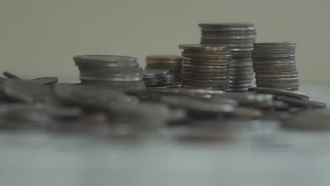 a large stack of various coins of american currency