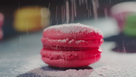 pink macarons with powdered sugar