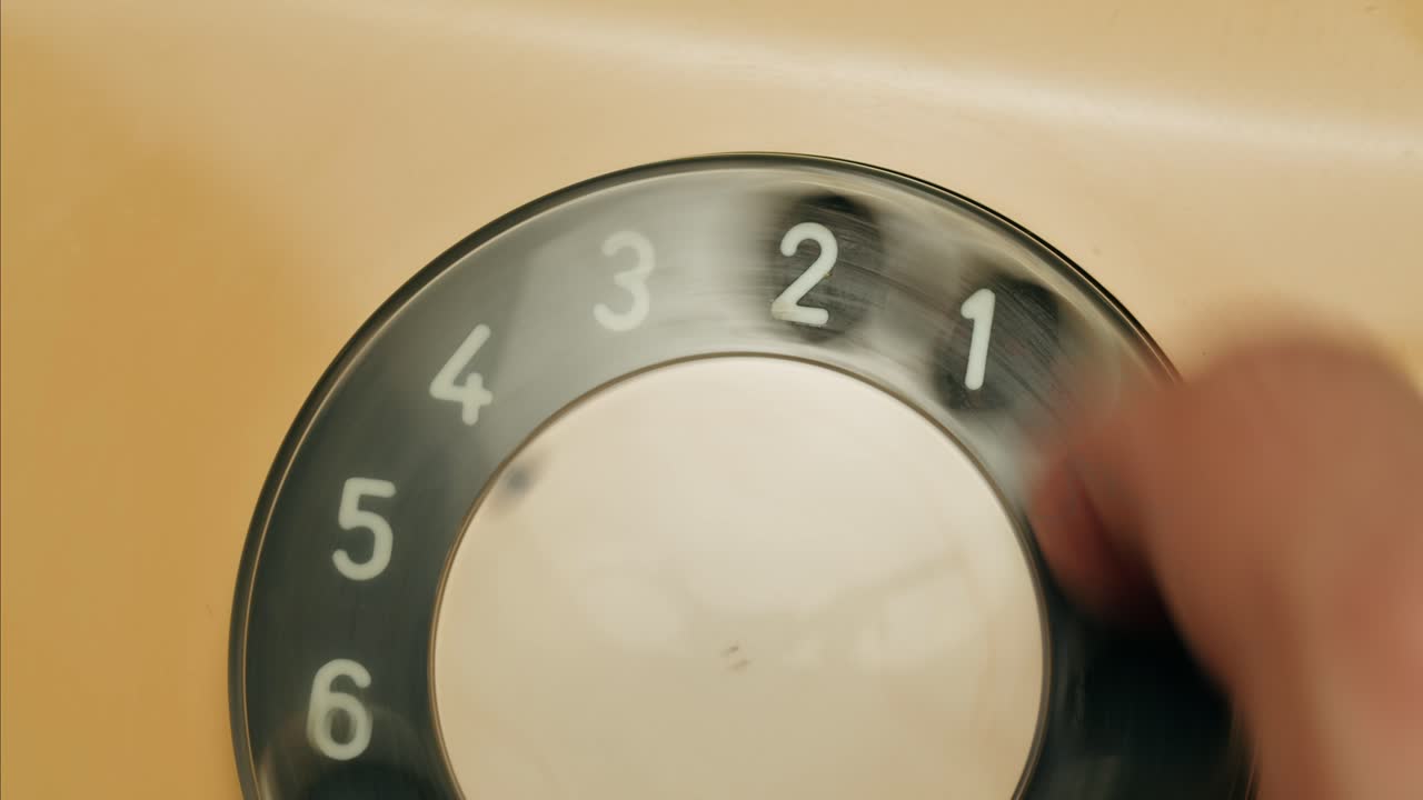 Retro vintage phone, A yellow rotary telephone is displayed on a wooden desk, adding a nostalgic touch