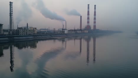 industrial landscape with smokestacks and river