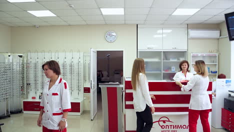 reception room at clinic. patients in waiting room in modern eye hospital
