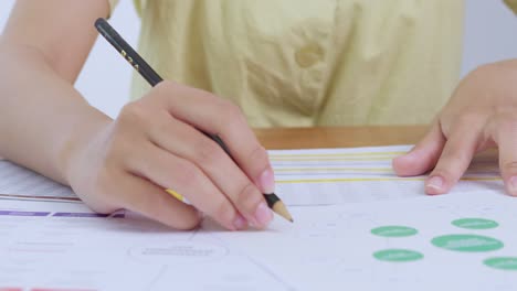 a person concentrates document analysis showcasing effective study habits a bright home office