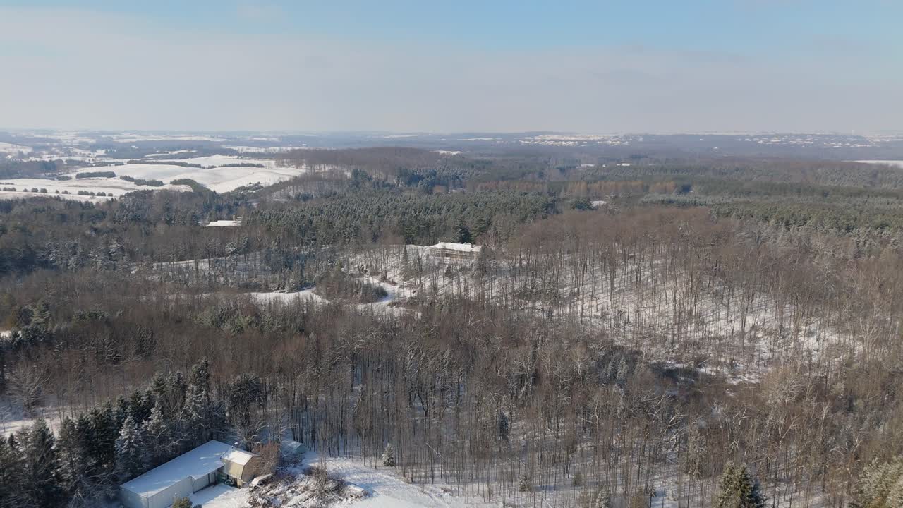 Aerial Flyover Of Rural Forest Landscape Covered In Snow At Caledon In Southern Ontario.
