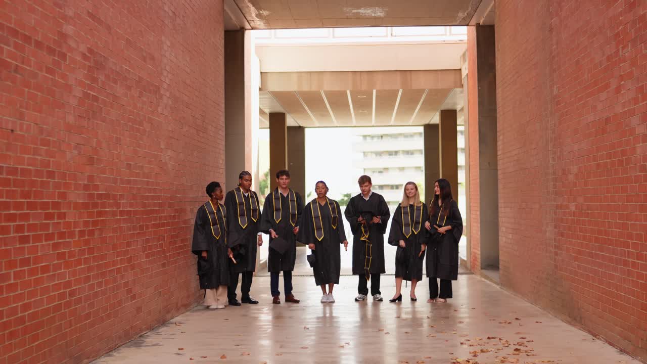 Graduates walking in a corridor