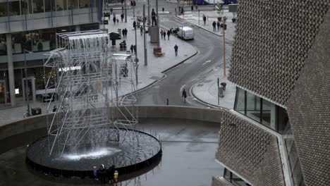 urban fountain and modern architecture in a city plaza