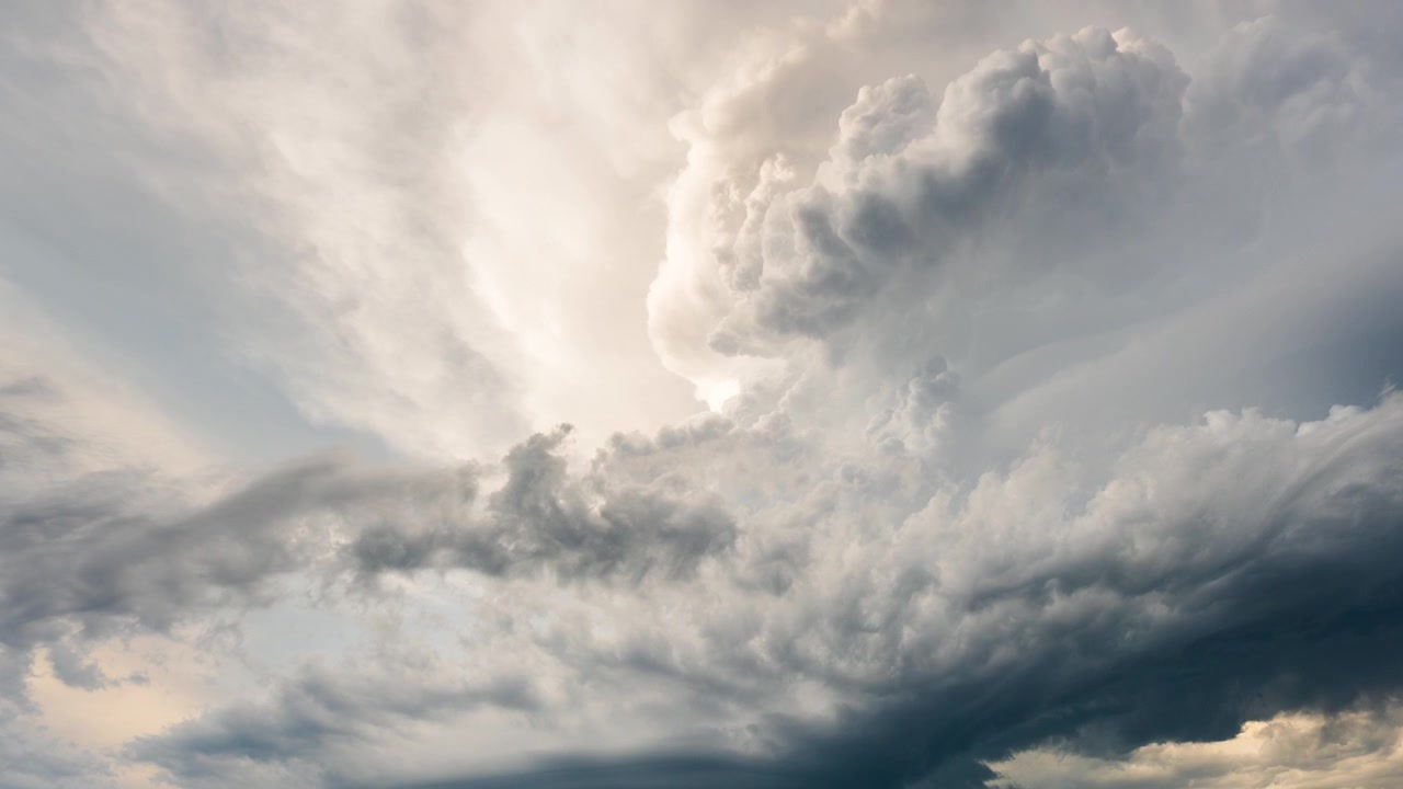 Dark cloud formations moving through the sky during a powerful storm scene