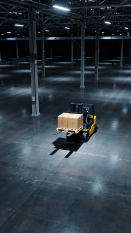 forklift carrying boxes in a large empty warehouse