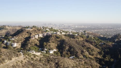 flying low over the hollywood hills toward downtown los angeles
