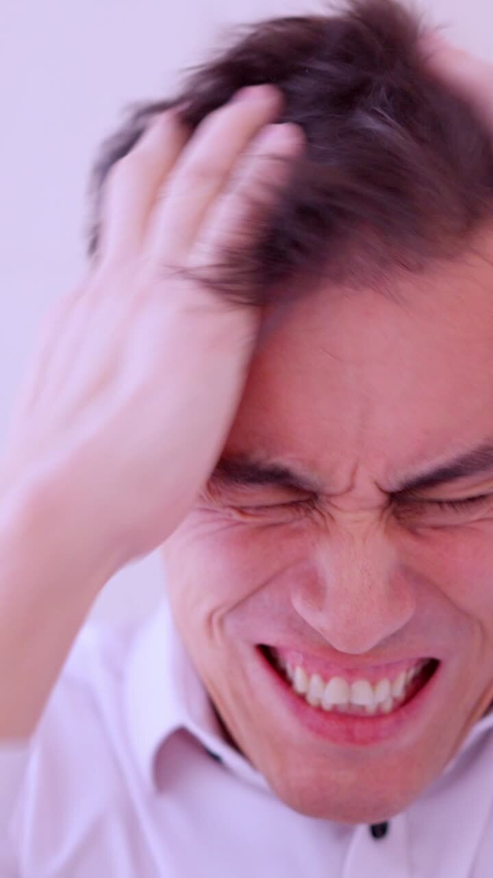 Insecure man combing hair before a date
