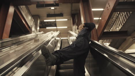 Janitor-dancer-rides-escalator-and-falls