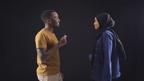 Black-man-and-woman-who-grew-up-in-African-culture-dance-and-chat.