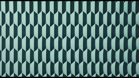 animation of green and black shapes moving in repetition