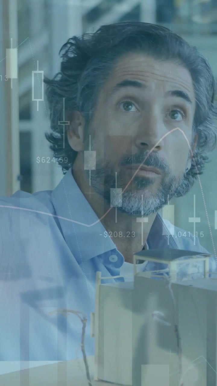 Vertical video: Man picking glasses, balancing on model for finance review, candlestick overlaying