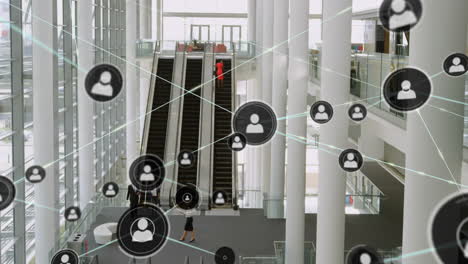 animation of network of connections with icons over escalator in office