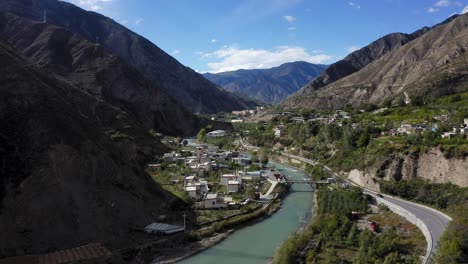 danba county town lined up along river in valley gorge of sichuan tibet, western china