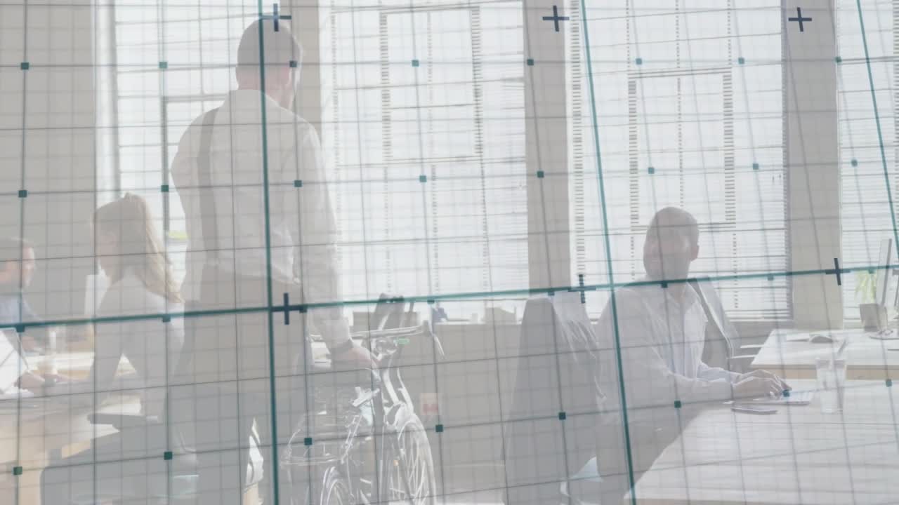 Team collaborating in modern business office, showing translucent grid overlay with floating graphs