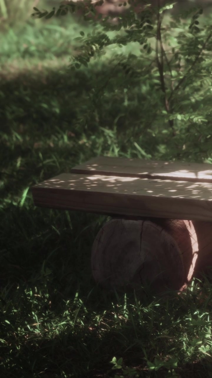 Wooden table in a grassy area under sunlight in a natural setting