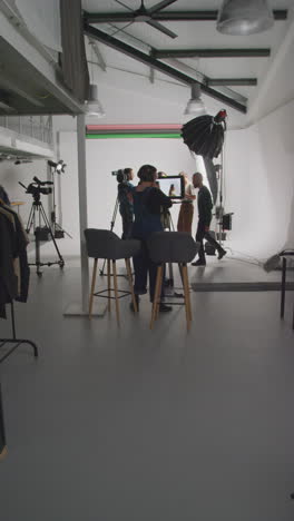 behind the scenes of a photoshoot in a studio