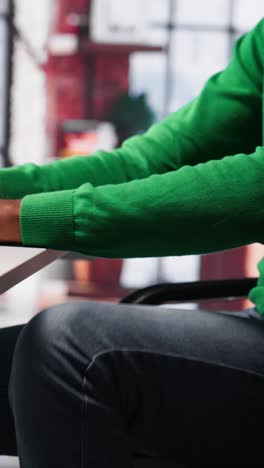 vertical video black man doing remote work feeling uneasy and anxious at desk