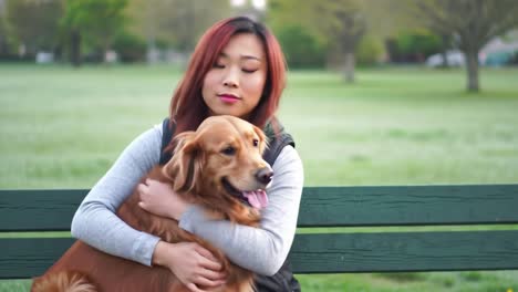 a tranquil moment of connection: a woman enjoys peaceful time with her loyal golden retriever in a beautiful park setting