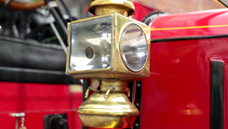 close up shot of a vintage lantern on an oldtimer bus coach