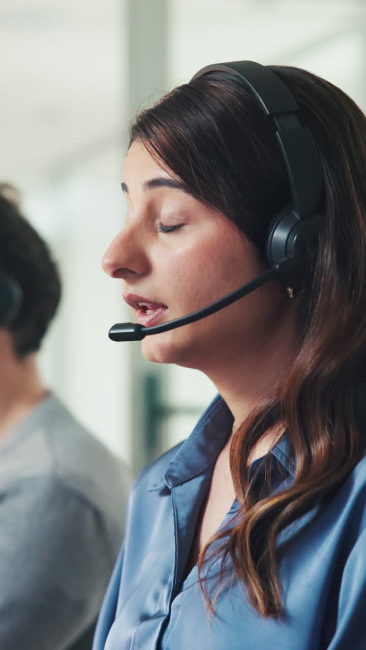 Woman Wearing Headset Talking in a Call Center Office