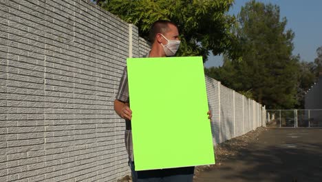 anti covid protester with mesh mask - green screen sign vertical