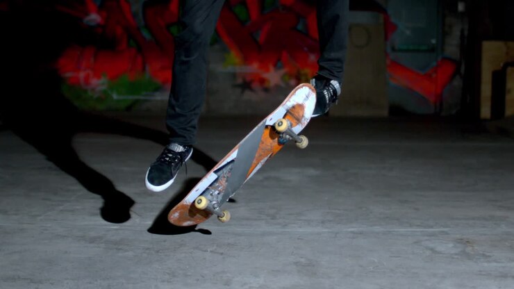 Skater rolling into kickflip trick