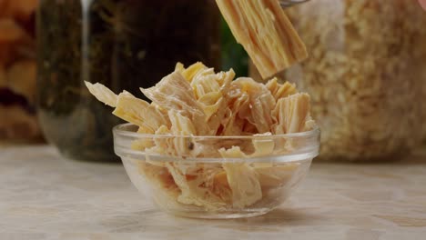 fermented soy food fuzhou, tofu skin yuba sticks or fuzhu on plate. healthy asian soy food, korean and chinese cuisine.
