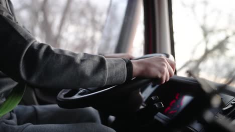 close up of truck driver driving forward