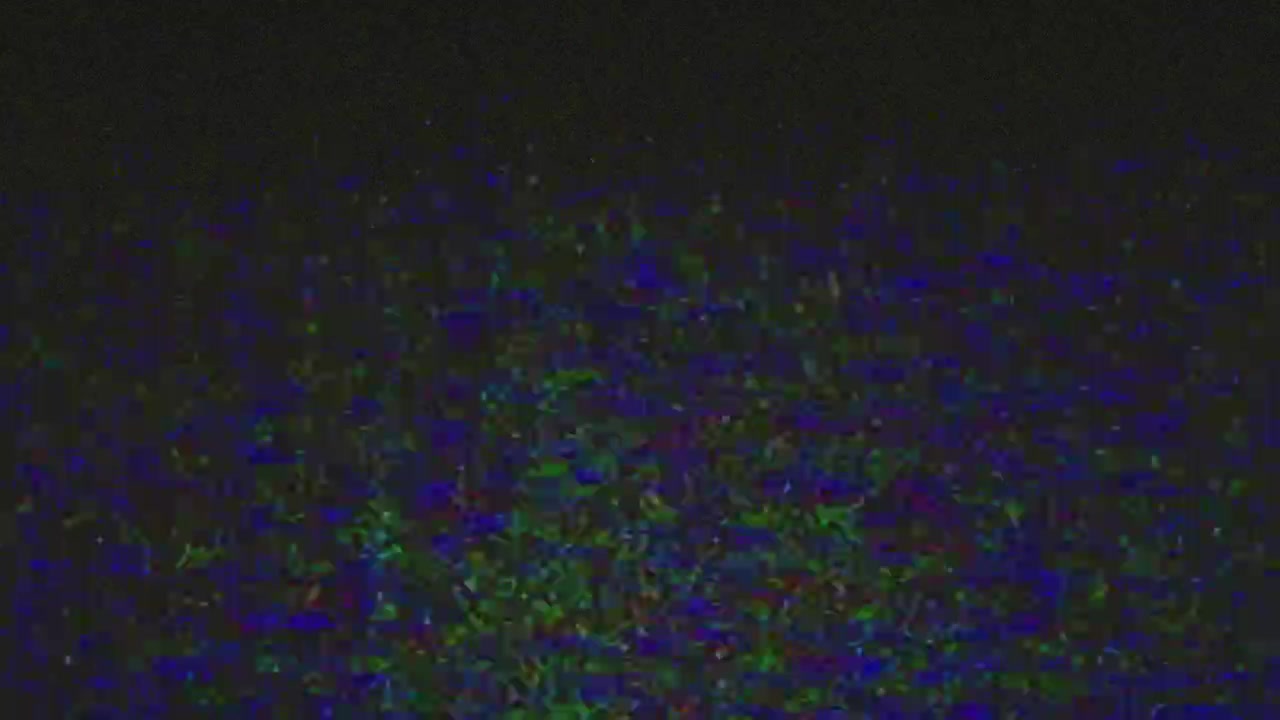 Digital Video Noise and Glitch Artifacts on Dark Background