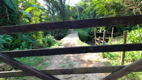 backing away from a rural wooden gate