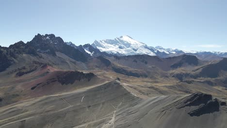 Forward-flight:-Discovering-the-beauty-of-Rainbow-Mountain,-Peru,-Ausangate-mountain-in-the-background