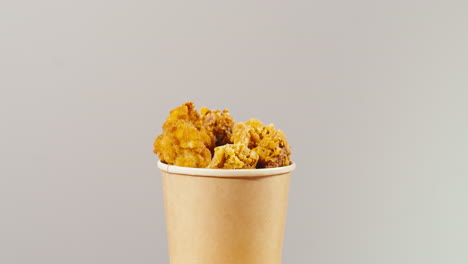 crispy fried chicken in a paper cup
