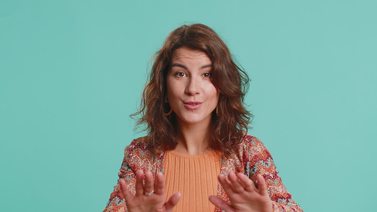 Young woman warning with admonishing finger gesture saying no be careful slowly avoid danger