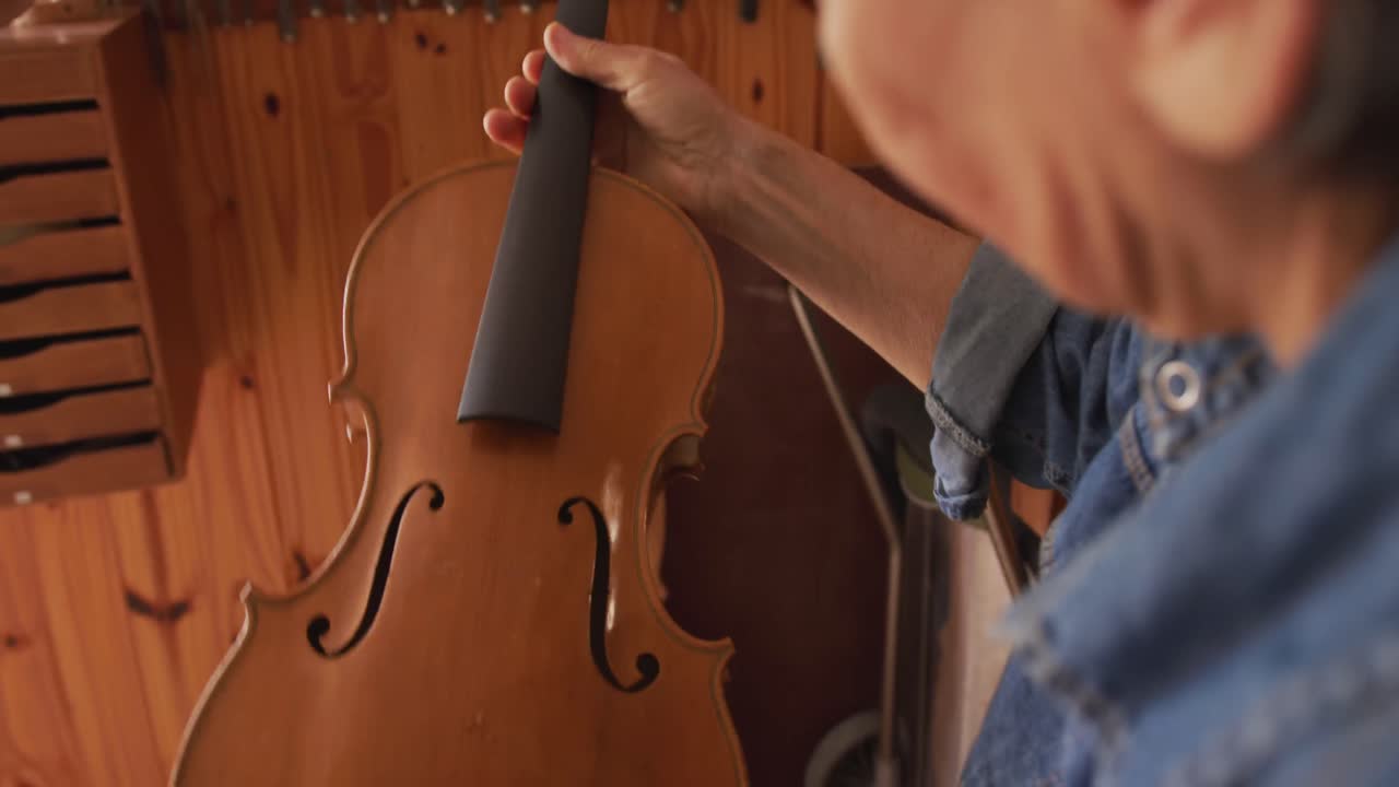 Female luthier at work in her workshop