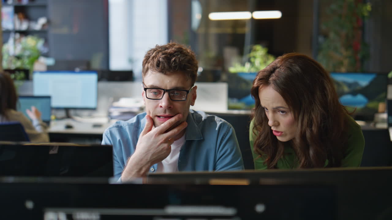 Couple colleagues planning strategy at open space room closeup. Partners talking